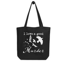 Load image into Gallery viewer, A black tote bag with a white graphic of a murder of crows with the words, "I love a good Murder" is hung on a peg in front of a white wall