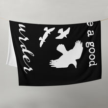 Load image into Gallery viewer, A black throw blanket with white silhouettes of a murder of crows and the words, "I love a good Murder" is draped over a clothes line.