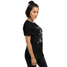 Load image into Gallery viewer, A woman is wearing a black graphic tee with a white silhouette of a murder of crows with the words "I love a good Murder" shown from the right side.