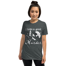 Load image into Gallery viewer, A woman is wearing a heather gray graphic tee with a white silhouette of a murder of crows with the words "I love a good Murder"