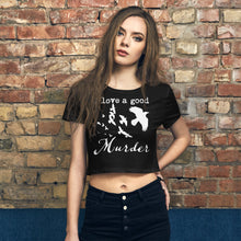Load image into Gallery viewer, Woman wearing a black crop tee with a white graphic of crows in flight and the words, "I love a goos Murder" in front of a brick wall.
